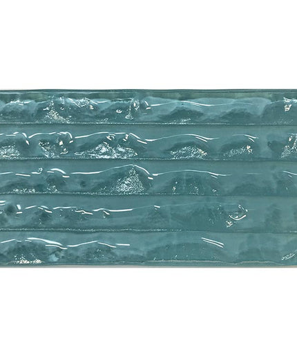 Glossy blue ceramic tile with textured, wavy surface for backsplash, shower, or pool design
