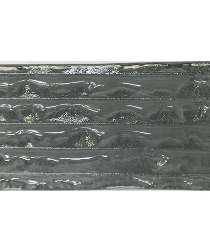 Glossy black ceramic tile with textured, wavy horizontal ridges for kitchen backsplash or bathroom.