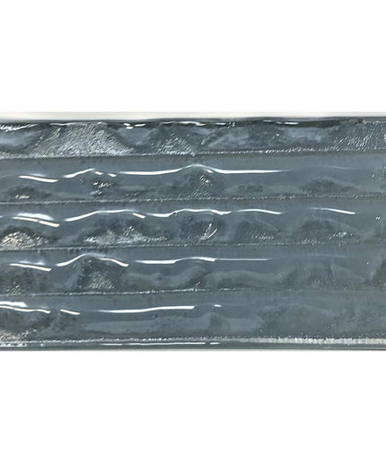 Glossy rectangular blue ceramic tile with textured wave pattern for backsplash or shower walls