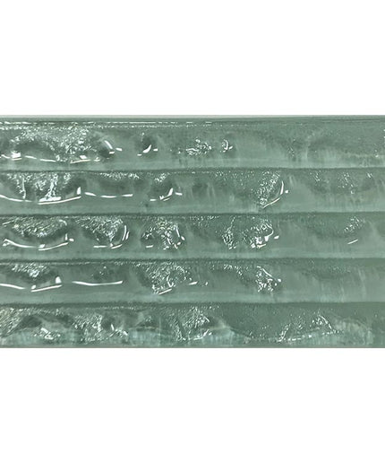 Textured glass tile with horizontal ridges in a seafoam green color, ideal for backsplash or shower walls.