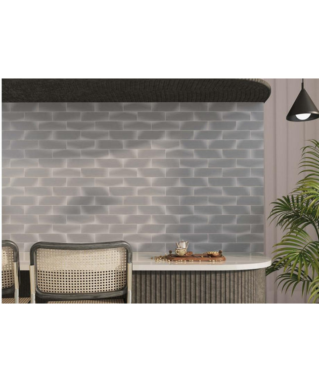 Gray brick-patterned wall with a table and chairs in a modern interior setting.