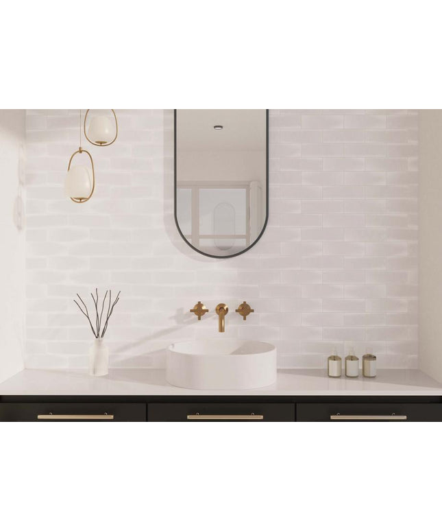 Modern bathroom with a sink, mirror, and decorative elements.