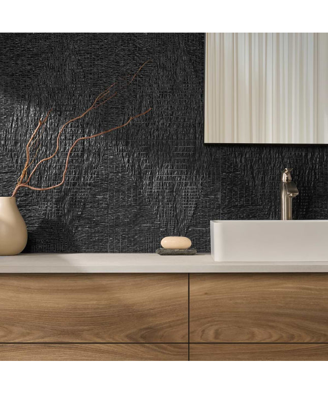 Bathroom vanity with wooden cabinets, white countertop, and black textured wall.