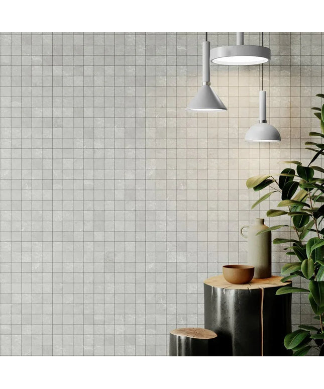 Matte white 12x12 mosaic wall tile sheet with modern lighting and decorative accents