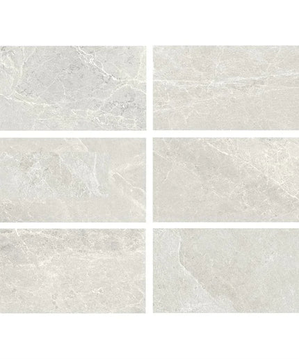 Set of six gray tiles with a marble-like texture on a white background