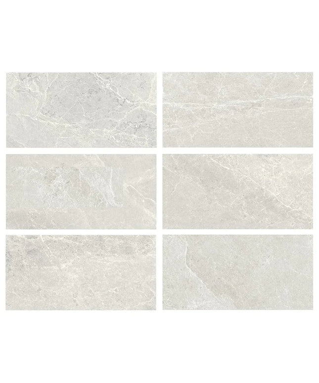 Set of six gray tiles with a marble-like texture on a white background