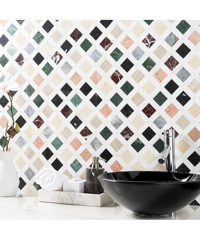 Bathroom setting with a black sink against a patterned tile wall.