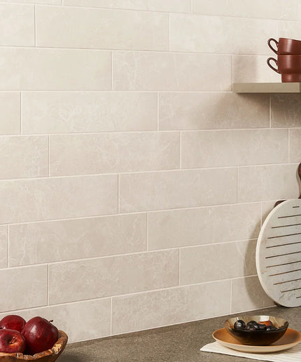 Cream Volterra 4x16 semi-polished wall tiles in a modern kitchen backsplash setting