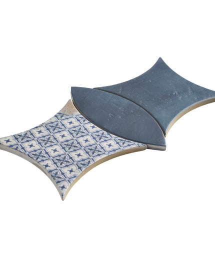 Decorative tile with blue and white pattern on a white background