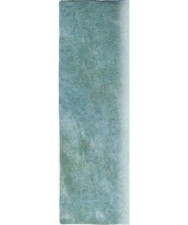 Rectangular green rug with a textured pattern on a solid background