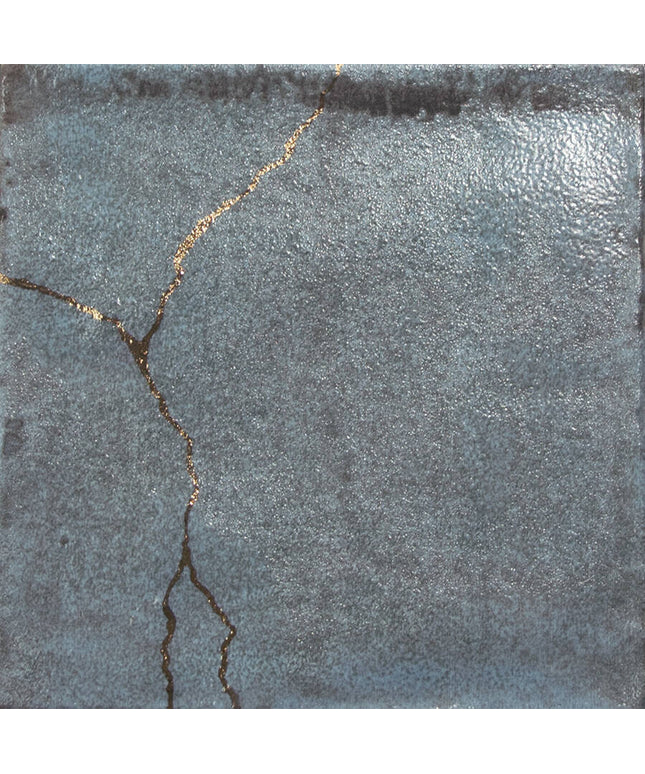 Textured gray surface with a crack running through it