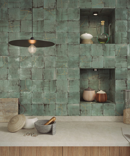 Green tiled wall with shelves and kitchen items in a modern kitchen setting