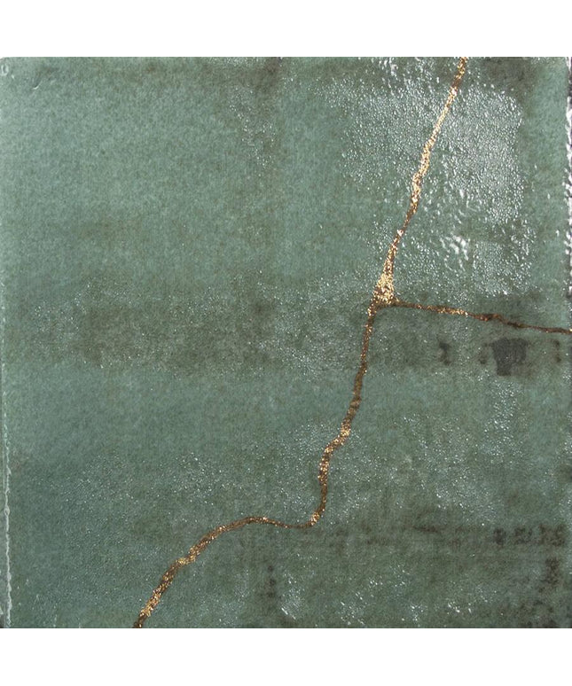 Green stone surface with a gold line running through it