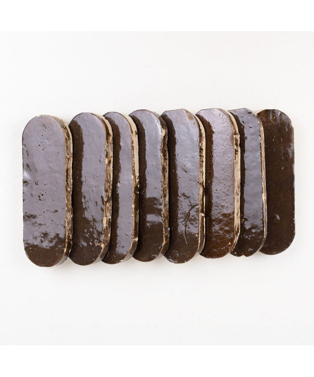 Espresso Noire oval ceramic tiles with glossy dark brown finish for backsplash or shower walls