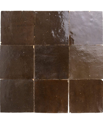 Square tiles with a brown and gray pattern on a white background