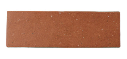 Rectangular terracotta floor tile with natural speckled finish, ideal for backsplash or bathroom use