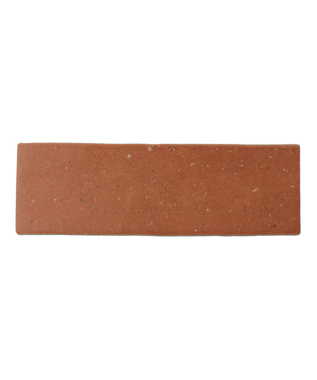 Rectangular terracotta floor tile with natural speckled finish, ideal for backsplash or bathroom use