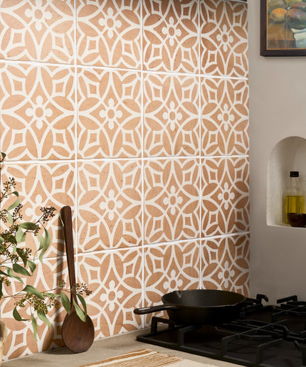 Terracotta floral patterned wall tile backsplash in a modern kitchen setting