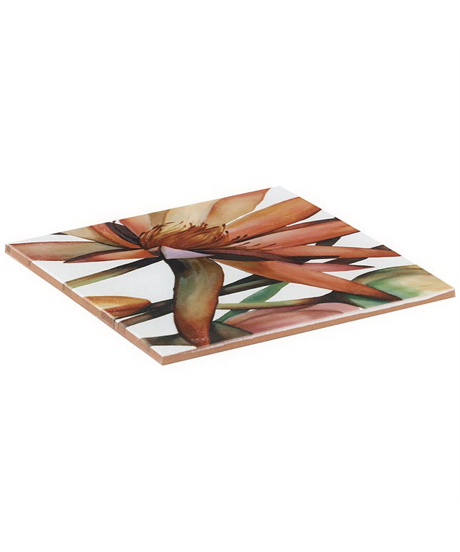 Square ceramic tile with a floral design on a white background