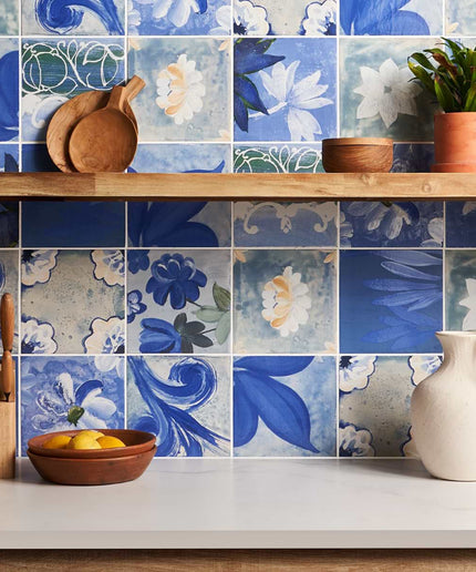 Kitchen with floral tile backsplash and wooden shelves.