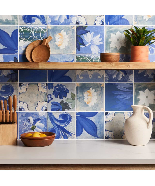 Kitchen with floral tile backsplash and wooden shelves.