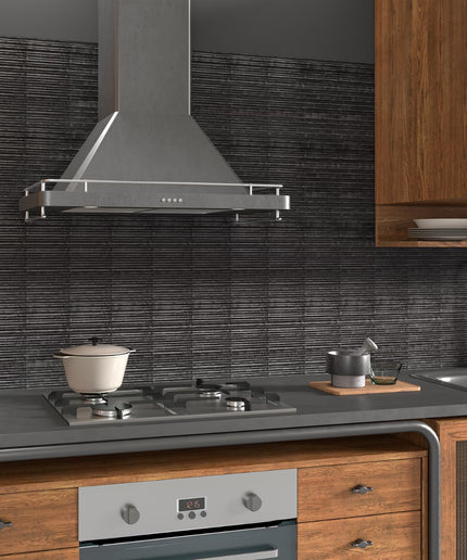 Modern kitchen with stainless steel range hood, stove, and wooden cabinets.