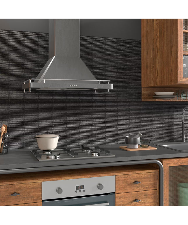 Modern kitchen with stainless steel range hood, stove, and wooden cabinets.