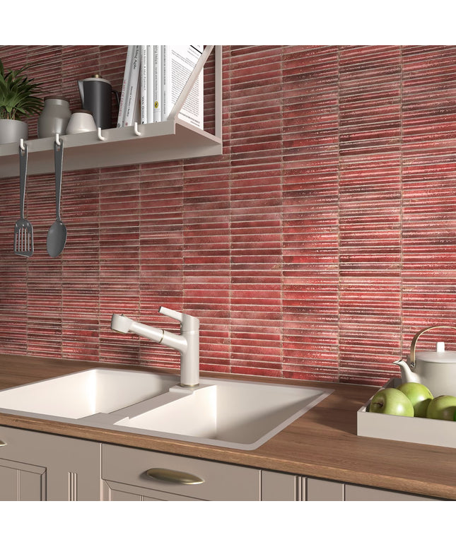 Kitchen with red tiled backsplash, white sink, and wooden countertop.
