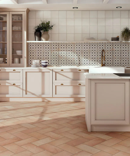 Modern kitchen with light wood cabinets, white tiled walls, and a checkered floor.