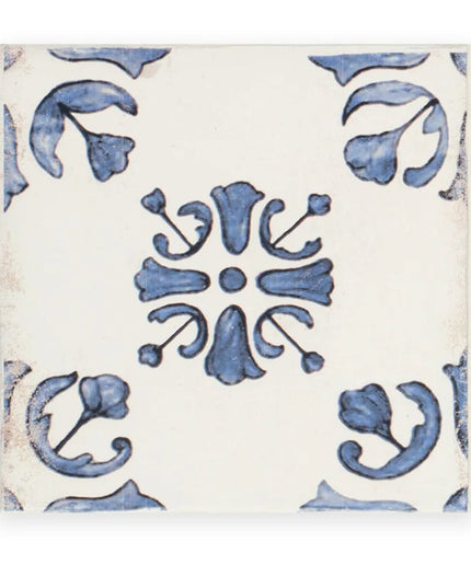 Decorative tile with blue floral pattern on a white background