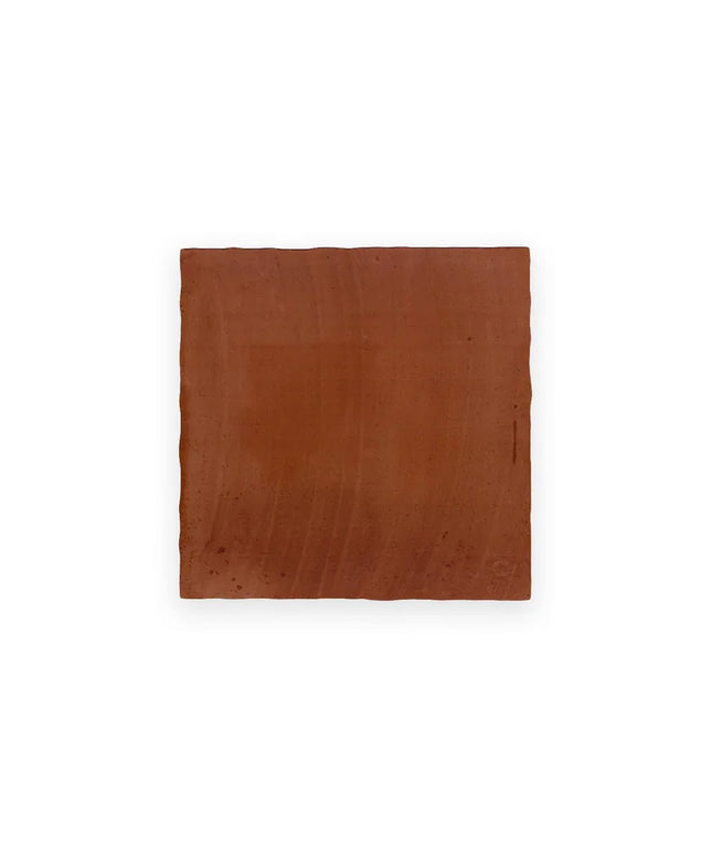 Square brown leather patch on a white background