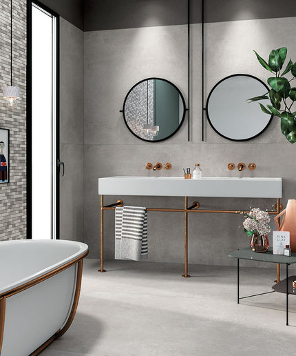 Modern bathroom with gray floor tiles, mosaic accent wall, and double vanity