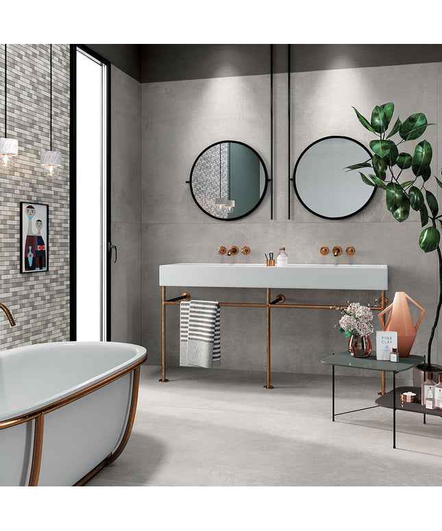 Modern bathroom with gray floor tiles, mosaic accent wall, and double vanity