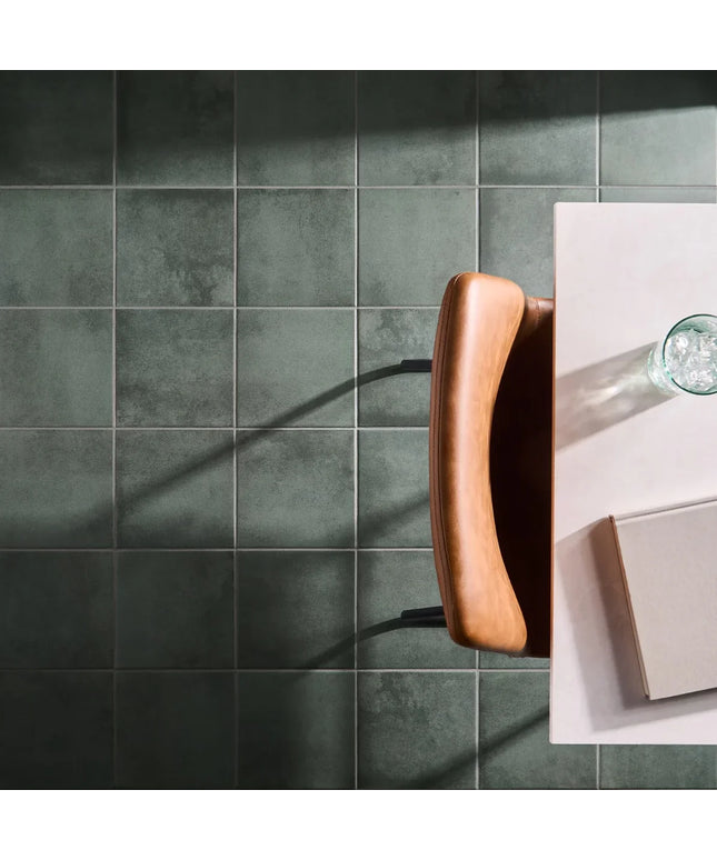 Collage of a dark green tiled wall and a kitchen counter with a wooden handle.