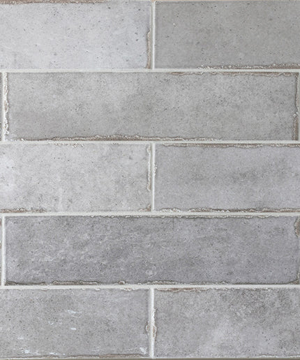 Pattern of gray tiles with a brick-like design