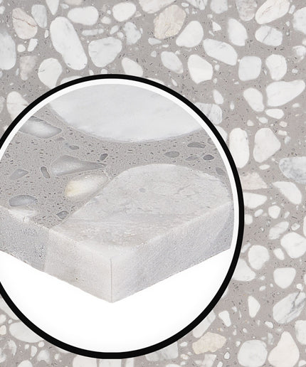 Close-up of a concrete block with a textured surface, surrounded by a circular inset.