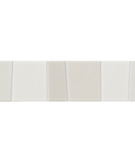 A horizontal strip of five rectangular glossy ceramic tiles in a warm off-white and cream color palette, set against a solid white background.