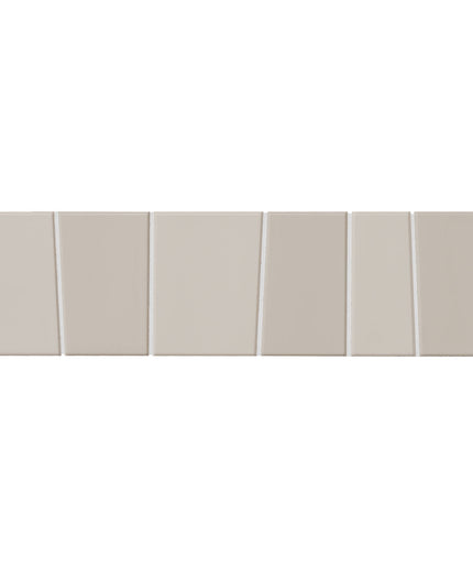 Six rectangular ceramic wall tiles in a warm light beige/taupe color, arranged in a staggered horizontal row with thin grout lines.
