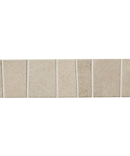A horizontal strip of rectangular beige stone or tile samples with subtle speckling and grout lines, shown against a plain white background.