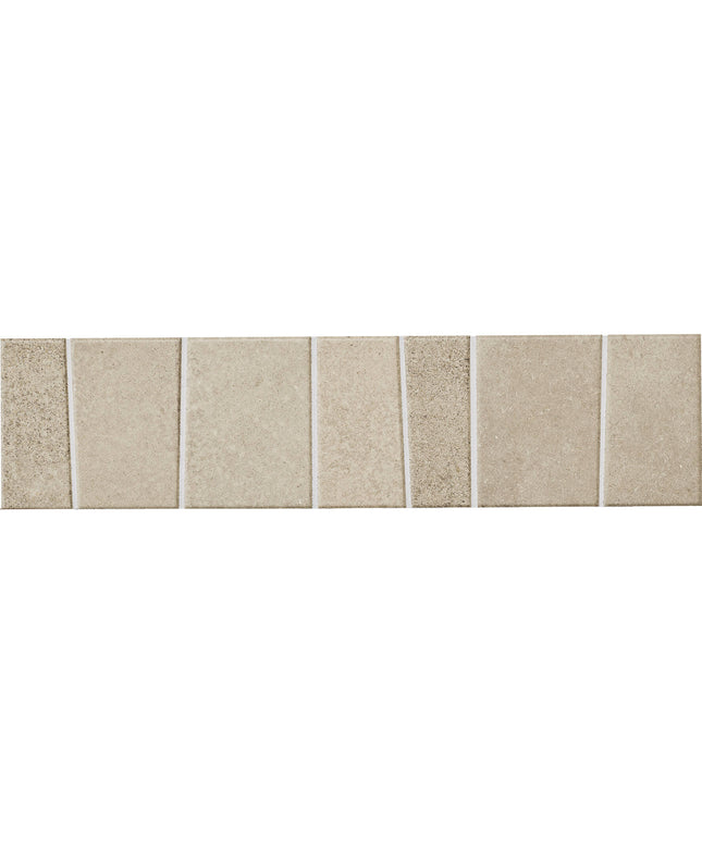 A horizontal strip of rectangular beige stone or tile samples with subtle speckling and grout lines, shown against a plain white background.