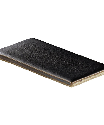 Black rectangular ceramic plate on a white background