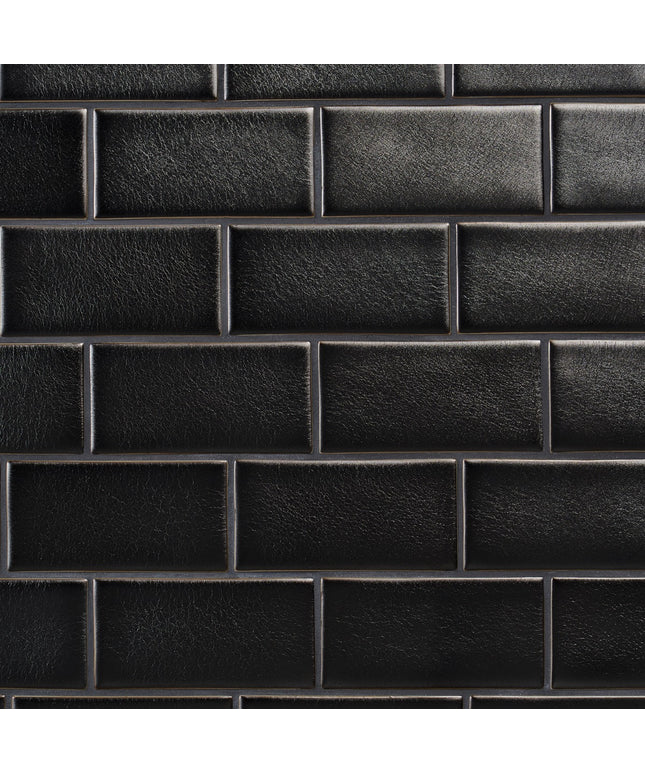 Close-up of a black leather texture with a grid pattern