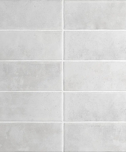 Gray tiles with a subtle pattern on a white background
