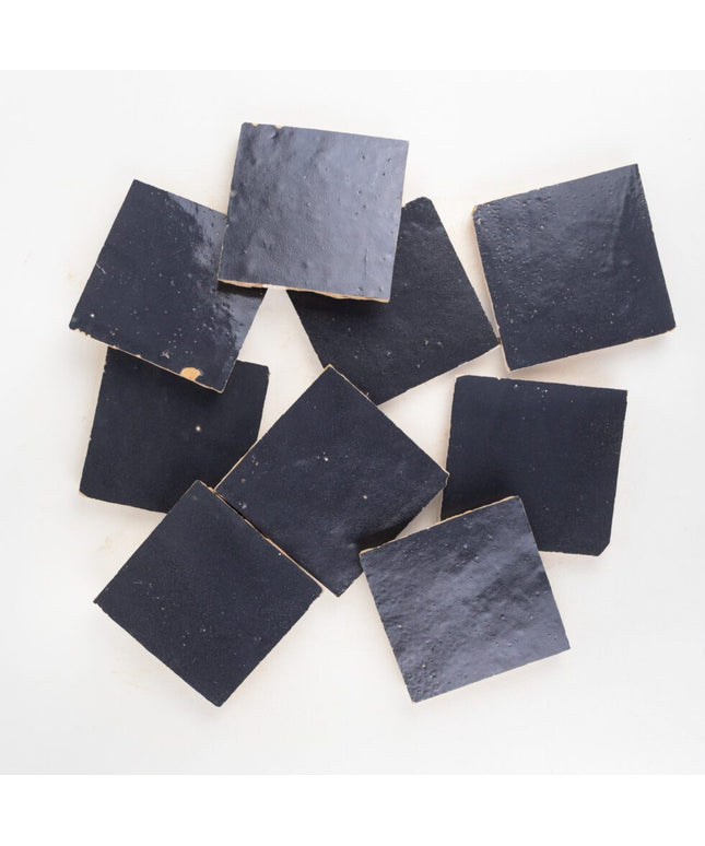 Indigo mist 4x4 zellige tiles with glossy, handmade finish on a white background