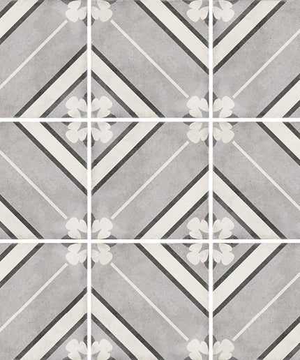 Patterned tiles with geometric design in gray, white, and black.
