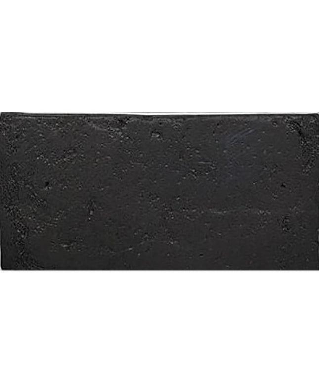 Rectangular Italian terracotta tile in matte charcoal black with textured surface