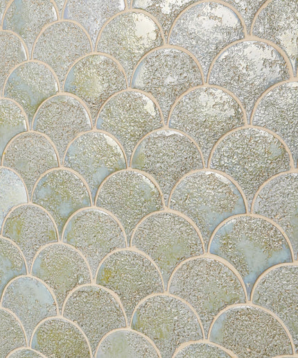 Pattern of circular tiles with a metallic sheen in various shades of green and silver.