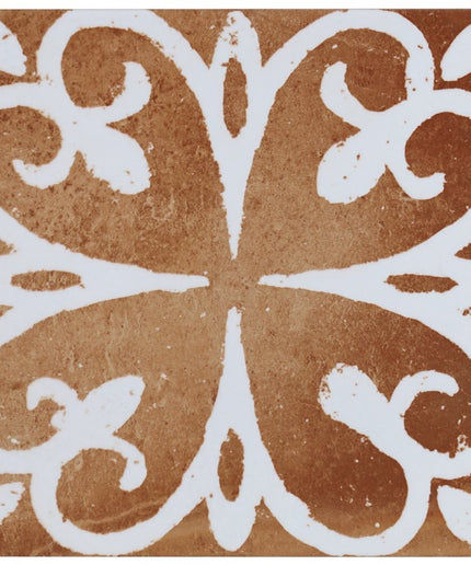 Decorative tile with white floral pattern on a brown background