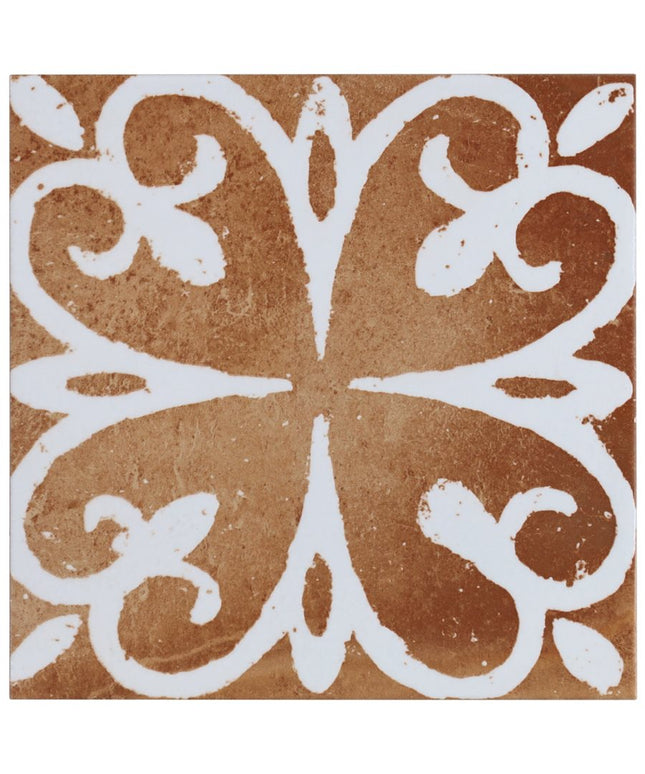 Decorative tile with white floral pattern on a brown background
