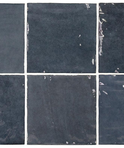 Six square tiles with a dark gray color and visible texture